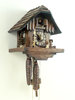 Shingle roof house with carved night watchman