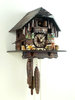 Dark Black Forest house with woodchopper and hen