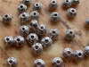 Tibetische Perlen - "Doppelkegel-Spacer-Perle, 5 x 3mm, Antik-Silber"